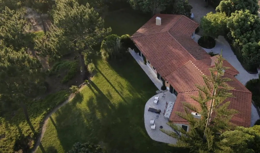 Aerial view of Villa Rio Seco, its garden and pine trees in Almoçageme, Sintra