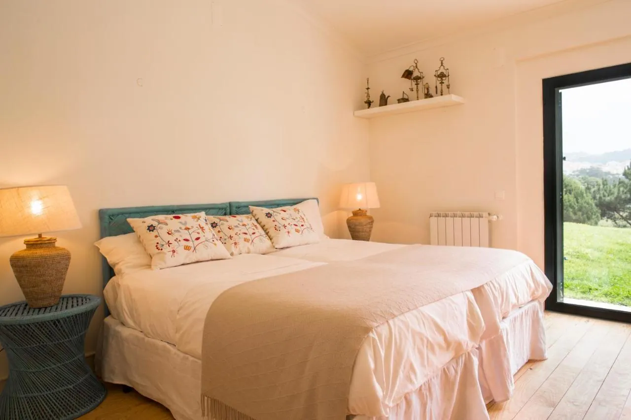 Bedroom with garden and hill views